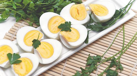 a plate of hard boiled eggs cut in half