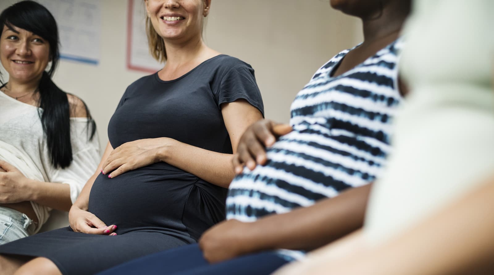 pregnant mothers sitting at an antenatal class
