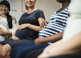 pregnant mothers sitting at an antenatal class