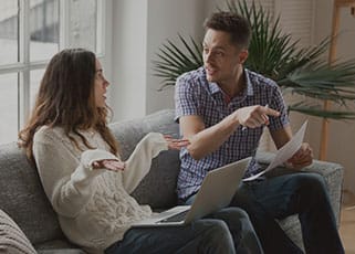 a mother and a father researching and debating on baby names