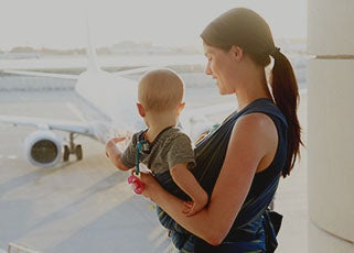 mother travelling with baby at the airport