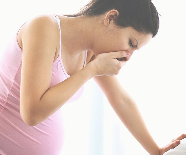 Pregnant mother experiencing morning sickness