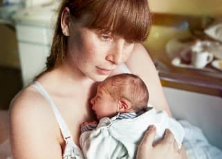 New mom holding newborn