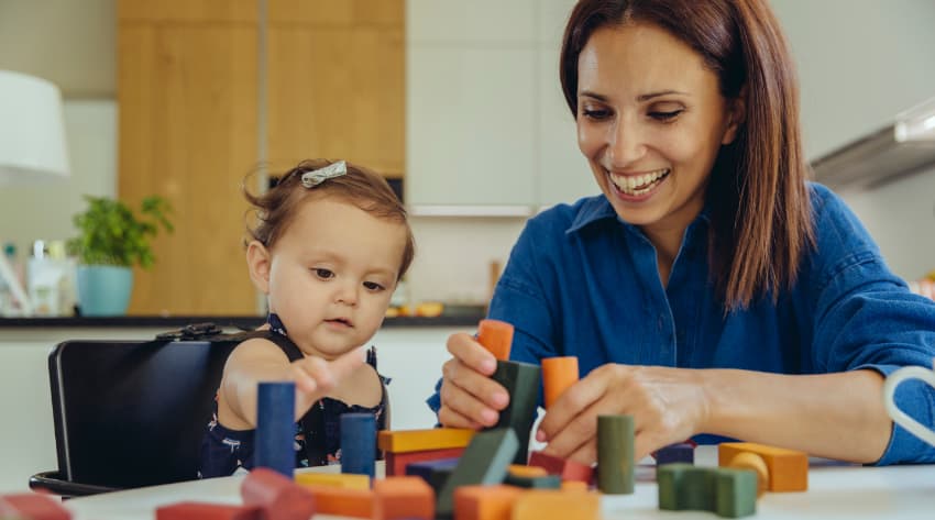 Mum playing an interactive game with a toddler