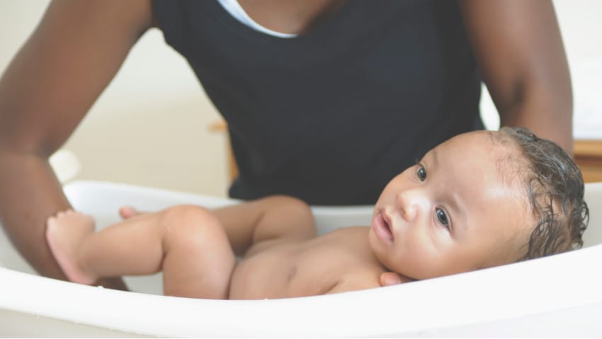 baby being bathed