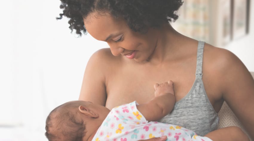 mother breastfeeding newborn baby