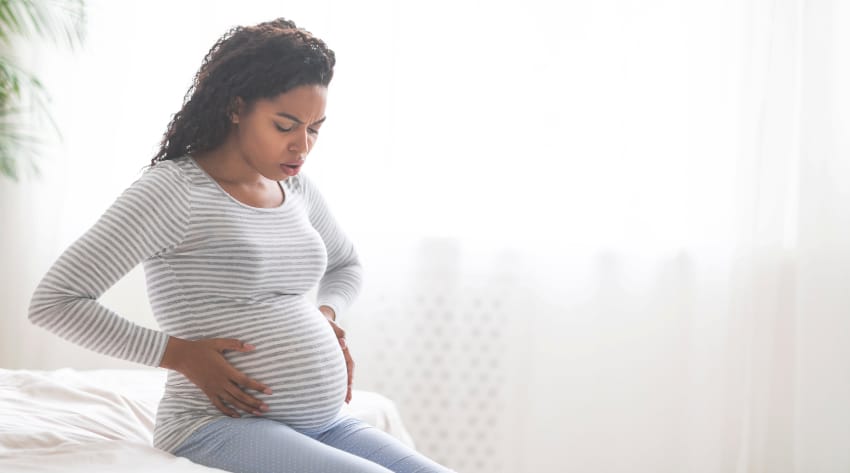 pregnant mother experiencing contractions and about to go into labour