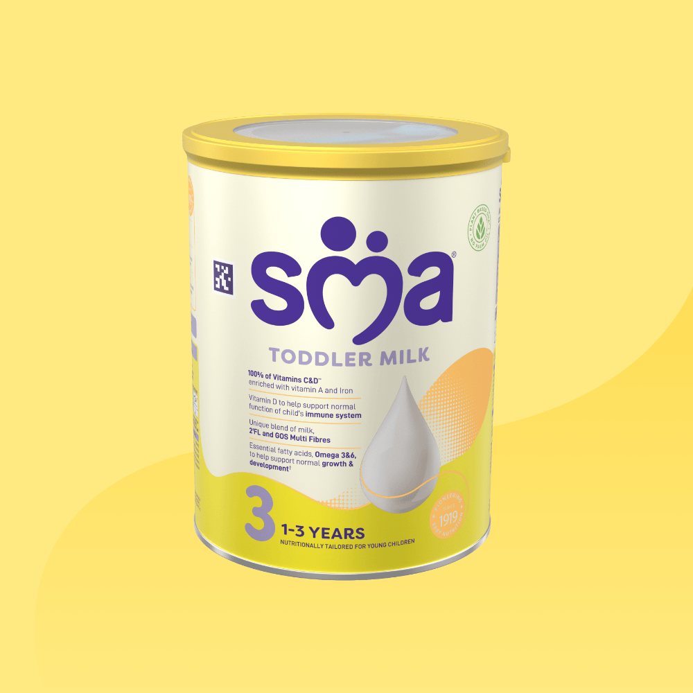 Tin of SMA Toddler Milk Powder for children 1 to 3 years, on a yellow background.