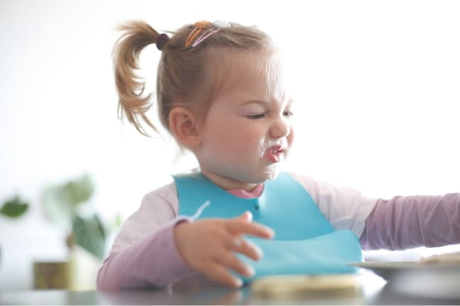 A child being fussy with their food