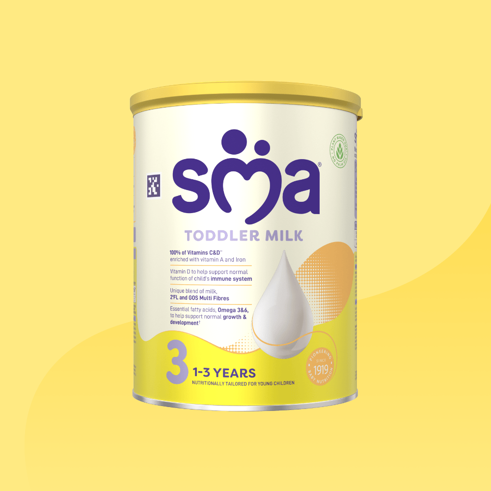 Tin of SMA Toddler Milk Powder for children 1 to 3 years, on a yellow background.