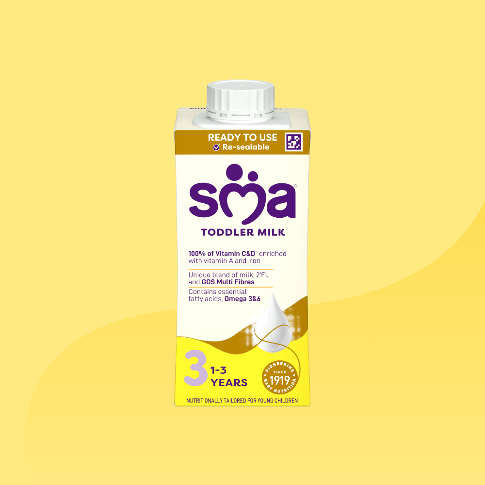Carton of SMA Toddler Milk Ready to Drink 200ml for children 1 to 3 years on a yellow background