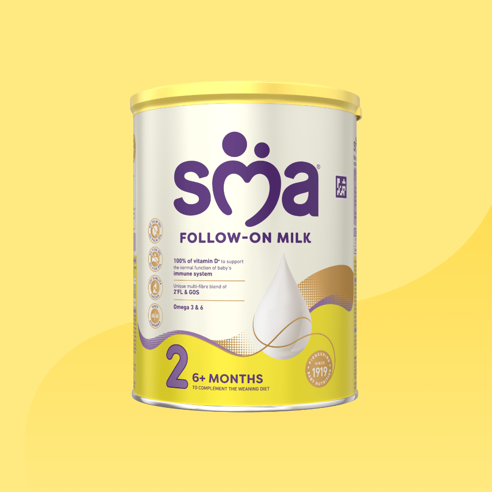 Tin of SMA Follow-on Milk Powder for babies 6-12 months with a yellow lid on a yellow background