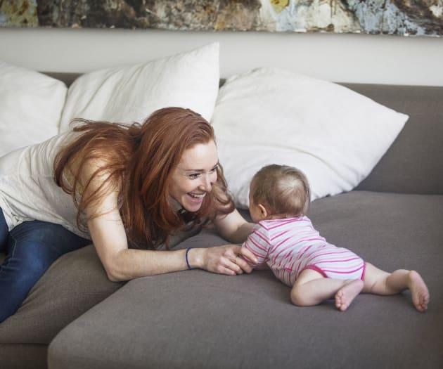 Mother smiling at baby