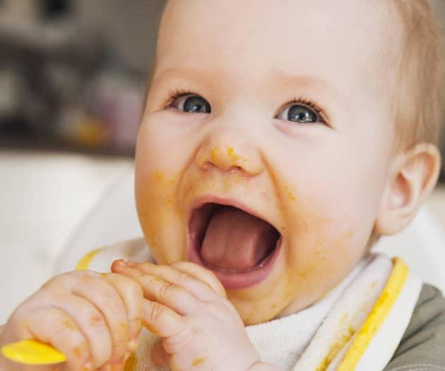 Baby eating with spoon